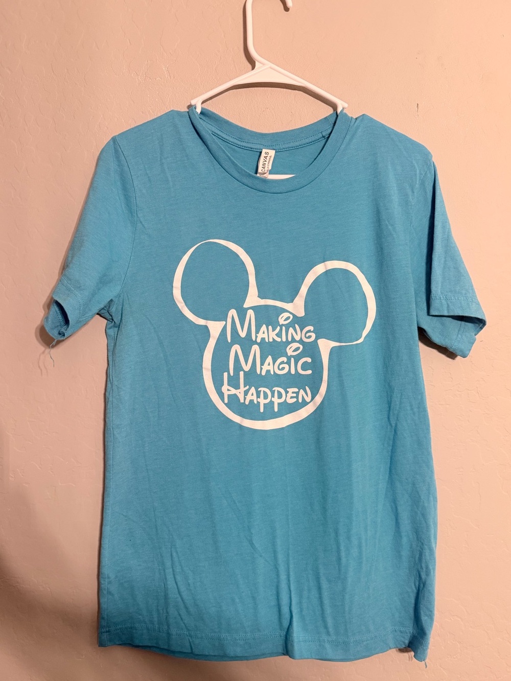 Bella Canvas Blue Short Sleeve Tee with White 'Making Magic Happen' Graphic